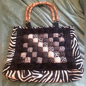 Vintage and unique, quilted black and white bag with wooden handles